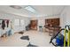 Bright workshop with ample workspace, tool storage, and convenient access to the outdoors at 5030 Princeton Trce, Cumming, GA 30041