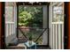 Charming balcony with seating offering scenic views of the lush greenery at 920 Memorial Se Dr # 11, Atlanta, GA 30316