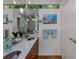 Modern bathroom features dual sinks, quartz countertops, and ample lighting at 920 Memorial Se Dr # 11, Atlanta, GA 30316