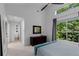 Bright bedroom featuring large windows with exterior view, dark furniture, and ensuite bathroom at 920 Memorial Se Dr # 11, Atlanta, GA 30316