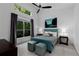 Bright bedroom featuring large windows and a unique light blue platform bed at 920 Memorial Se Dr # 11, Atlanta, GA 30316