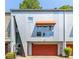 Modern townhome features a metal facade, red garage door, and awning for a contemporary look at 920 Memorial Se Dr # 11, Atlanta, GA 30316