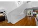 Bright foyer with wood floors and modern railing lead to a living space filled with natural light at 920 Memorial Se Dr # 11, Atlanta, GA 30316