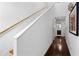 Bright hallway with hardwood floors, a staircase, and access to the bathroom offers a clean design at 920 Memorial Se Dr # 11, Atlanta, GA 30316