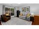 Cozy living room featuring neutral tones, a patterned rug, and a view of the outdoor space at 920 Memorial Se Dr # 11, Atlanta, GA 30316
