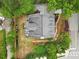 Aerial view of the home showcasing its well-maintained roof, landscaping, and neighborhood surroundings at 100 Barnard Pl, Atlanta, GA 30328