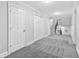 Spacious basement area features plush carpeting, neutral paint, and staircase access at 100 Barnard Pl, Atlanta, GA 30328