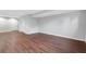 Finished basement features wood-look floors, and neutral walls at 100 Barnard Pl, Atlanta, GA 30328