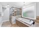 A beautifully designed bathroom with a soaking tub and glass shower at 100 Barnard Pl, Atlanta, GA 30328