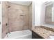 Bathroom featuring tiled shower, niche, and granite-topped vanity at 100 Barnard Pl, Atlanta, GA 30328
