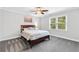 Serene bedroom with a ceiling fan, ample natural light, and neutral decor at 100 Barnard Pl, Atlanta, GA 30328