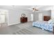 Bedroom featuring carpeted floor, dresser, and walk-in closet at 100 Barnard Pl, Atlanta, GA 30328