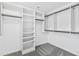 Walk-in closet with built-in shelving and clothing rods providing ample storage space at 100 Barnard Pl, Atlanta, GA 30328