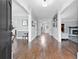 Bright foyer with hardwood floors, view of the staircase, and open to the living room at 100 Barnard Pl, Atlanta, GA 30328