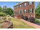 Charming brick home with manicured front yard, inviting entrance with steps, and decorative landscaping for great curb appeal at 100 Barnard Pl, Atlanta, GA 30328