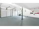 Spacious three-car garage offering ample room for vehicles and storage, featuring bright lighting and pegboard at 100 Barnard Pl, Atlanta, GA 30328