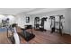 Basement workout area featuring modern exercise equipment and wood flooring at 100 Barnard Pl, Atlanta, GA 30328