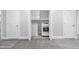 Convenient laundry closet featuring a side-by-side washer and dryer, storage shelves at 100 Barnard Pl, Atlanta, GA 30328