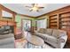 Comfortable living room features a fireplace, built-in bookshelves, and a cozy seating area at 100 Barnard Pl, Atlanta, GA 30328