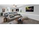 Spacious living room with comfortable seating, large windows and recessed lighting at 100 Barnard Pl, Atlanta, GA 30328