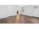 Living room featuring wood-look floors, neutral walls, and ensuite bathroom at 100 Barnard Pl, Atlanta, GA 30328