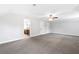 Expansive room featuring neutral paint, carpet, and fan ready for new design at 100 Barnard Pl, Atlanta, GA 30328