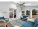 Bright sunroom with comfortable seating, skylights, and views of the backyard at 100 Barnard Pl, Atlanta, GA 30328