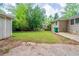 Backyard featuring a home's exterior, lawn and surrounding trees at 1774 Austin Dr, Decatur, GA 30032