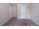 Carpeted room with a closet and white walls and neutral-colored carpet at 1774 Austin Dr, Decatur, GA 30032