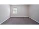 Neutral-colored room with carpet and a window bringing in natural light at 1774 Austin Dr, Decatur, GA 30032