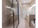 Bathroom features a glass shower, granite countertop, a large mirror, and tiled floors at 2448 Gatebury Cir, Atlanta, GA 30341
