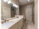 Bathroom with double sinks, granite countertop, a large mirror, and tiled floors at 2448 Gatebury Cir, Atlanta, GA 30341