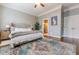 Well-lit primary bedroom with hardwood floors, a ceiling fan, and a walk-in bathroom at 2448 Gatebury Cir, Atlanta, GA 30341