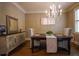Elegant dining room with a chandelier, a wooden table, and neutral decor at 2448 Gatebury Cir, Atlanta, GA 30341