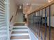 Inviting foyer featuring a staircase with wooden handrail and elegant wrought iron balusters at 2448 Gatebury Cir, Atlanta, GA 30341