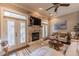 Comfortable living room with a stone fireplace, French doors, and stylish accent chairs at 2448 Gatebury Cir, Atlanta, GA 30341