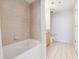 Bright bathroom featuring tile surround and flooring at 3338 Peachtree Rd # 1210, Atlanta, GA 30326