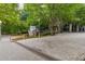 Well-maintained exterior of Buckhead Grand building with lush greenery, modern architecture, and paved walkway at 3338 Peachtree Rd # 1210, Atlanta, GA 30326