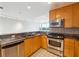Bright kitchen features granite countertops, stainless steel appliances and views of the city at 3338 Peachtree Rd # 1210, Atlanta, GA 30326