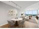 Bright living and dining room featuring a neutral palette, floor-to-ceiling windows, and stylish decor at 3338 Peachtree Rd # 1210, Atlanta, GA 30326