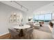 Bright living room features modern furnishings, hardwood floors, and large windows with city views at 3338 Peachtree Rd # 1210, Atlanta, GA 30326