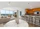 Open-concept living space featuring a modern kitchen, dining area, and comfortable seating with a view at 3338 Peachtree Rd # 1210, Atlanta, GA 30326