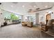 Resident lounge with tables, chairs, and a large window at 3338 Peachtree Rd # 1210, Atlanta, GA 30326