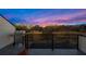 This balcony features a gas grill and unobstructed views of the evening skyline at 337 Pine Ne St # B, Atlanta, GA 30308
