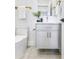 Stylish half bathroom features modern fixtures, gold accents, and a sleek vanity at 337 Pine Ne St # B, Atlanta, GA 30308