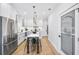 Bright kitchen featuring an island, stainless steel appliances, and a decorative pantry door at 337 Pine Ne St # B, Atlanta, GA 30308