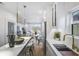 Bright kitchen with a view into the living area featuring an island and modern countertops at 337 Pine Ne St # B, Atlanta, GA 30308