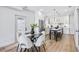 A modern kitchen and dining area featuring stainless steel appliances and bright white cabinets at 337 Pine Ne St # B, Atlanta, GA 30308