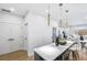 Open concept kitchen with a large island, pendant lighting, and seamless flow to the living area at 337 Pine Ne St # B, Atlanta, GA 30308