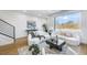 Modern living room with stylish decor, hardwood floors, and large window overlooking trees at 337 Pine Ne St # B, Atlanta, GA 30308